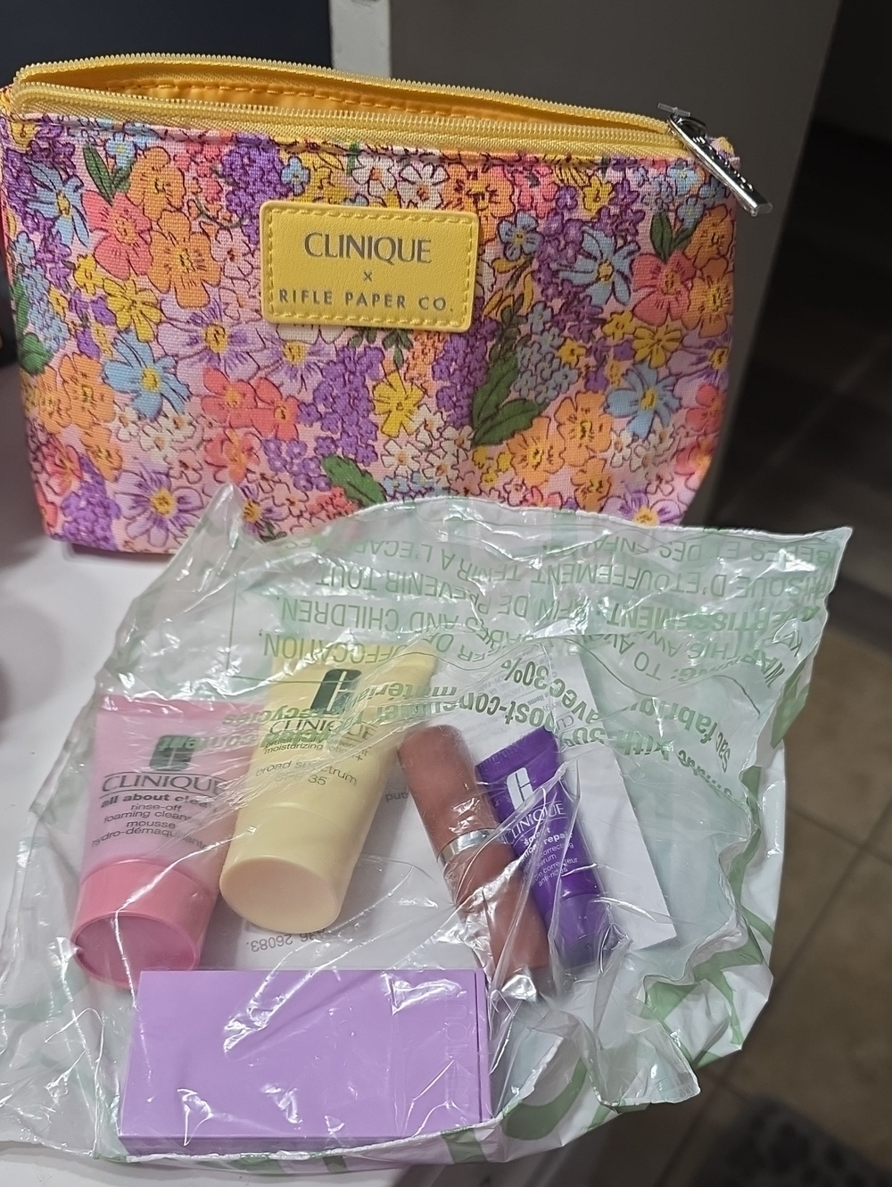 Clinique Floral Multi-Color Cosmetic Pouch with Mini Skincare Trio
